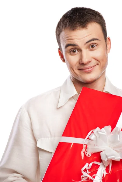Smiling man holding gift isolated on white — Stock Photo, Image