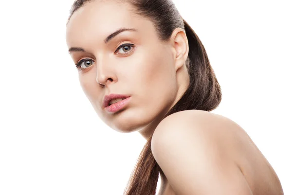 Beautiful woman's face with clean skin on white Stock Image