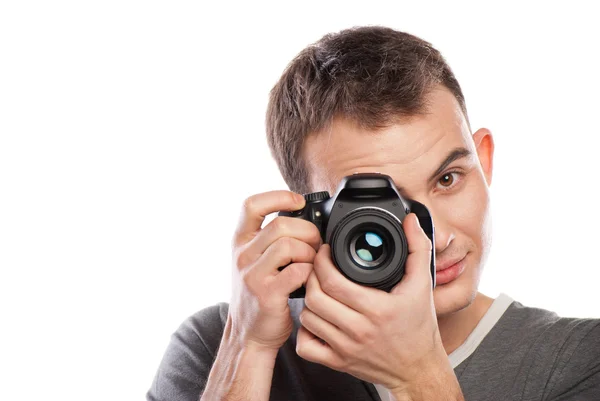 Male photographer with camera isolated on white — Stock Photo, Image