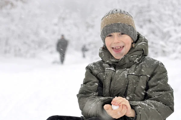 Boy with snowball — Stock Photo, Image