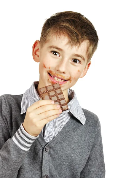 Chłopiec jedzący czekoladę — Zdjęcie stockowe