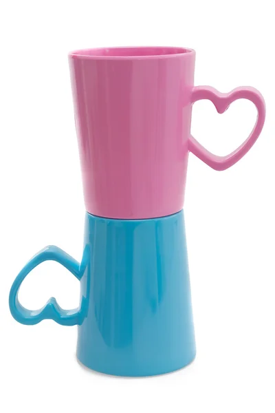 Розовые и голубые чашки, изолированные — стоковое фото