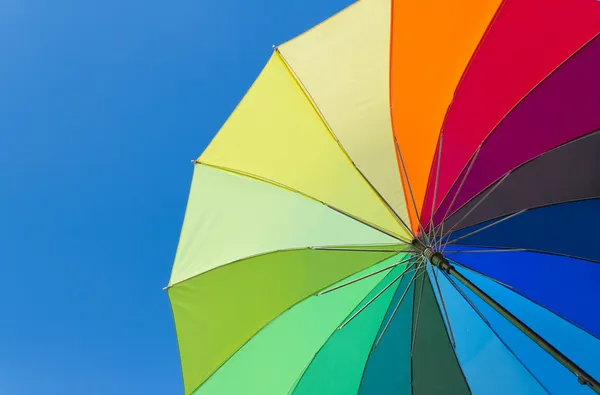 Colorful umbrella on a sky background — Stock Photo, Image