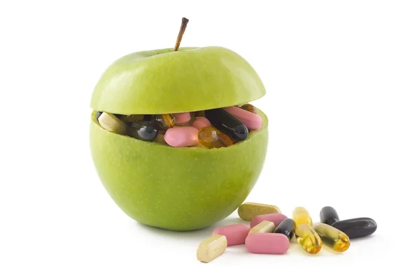 Apfel mit Pillen — Stockfoto