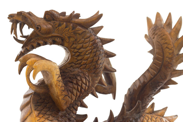 Wooden dragon, symbol of chinese new year, isaolated on white ba