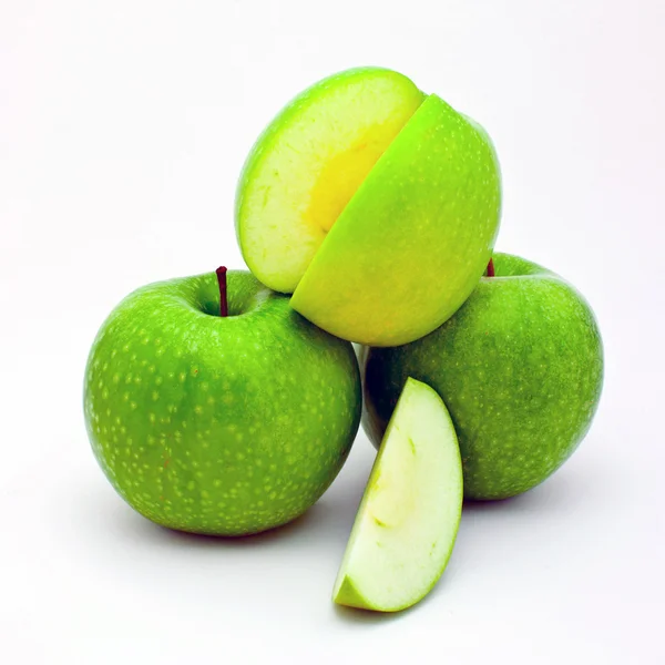 Segmento de maçã e três maçãs — Fotografia de Stock