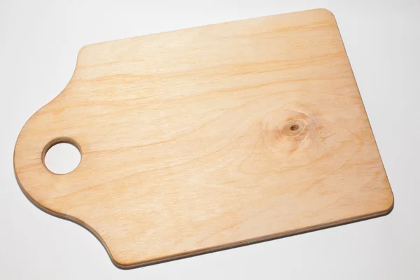Tabla de cortar de madera sobre un fondo blanco —  Fotos de Stock