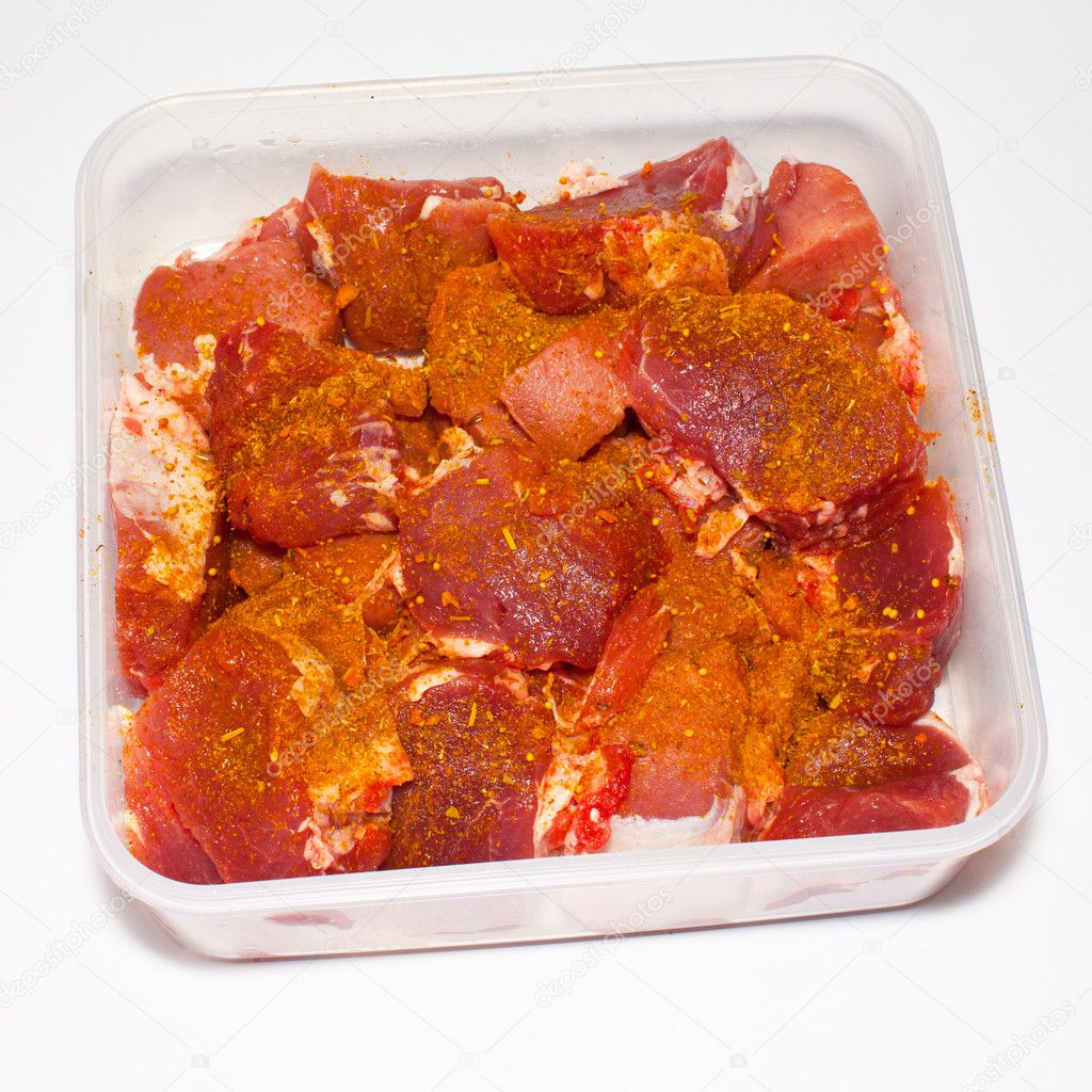 The pickled meat in a tray on a white background