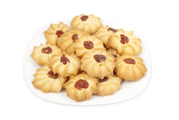 Biscotti di pasta frolla con marmellata su un piatto bianco Fotografia Stock