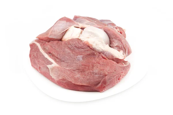 Beyaz bir plaka üzerinde kemik biftek — Stok fotoğraf