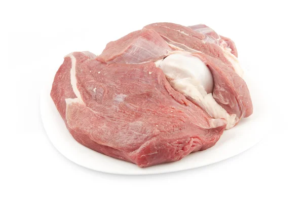 Beyaz bir plaka üzerinde kemik biftek — Stok fotoğraf