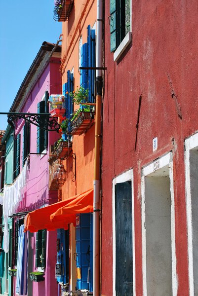 Colorful houses on the canals in Burano Island, Venice, Italy