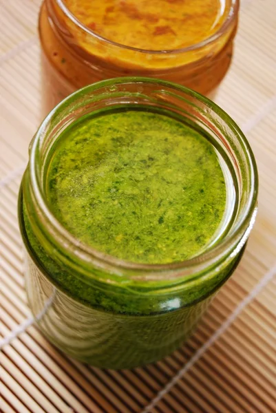 Stock image Pesto and tomatoes sauce