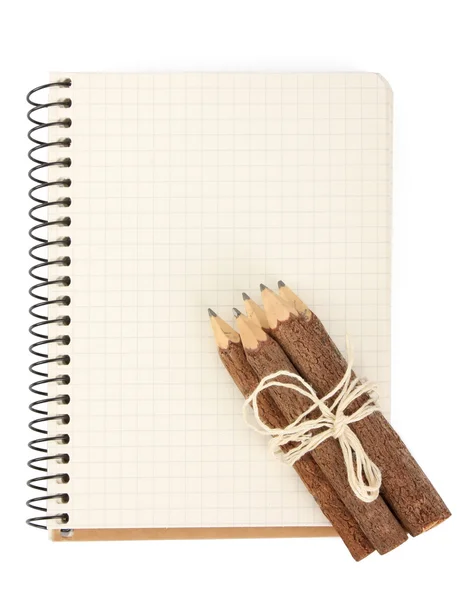 Блокнот та олівці на білому — стокове фото
