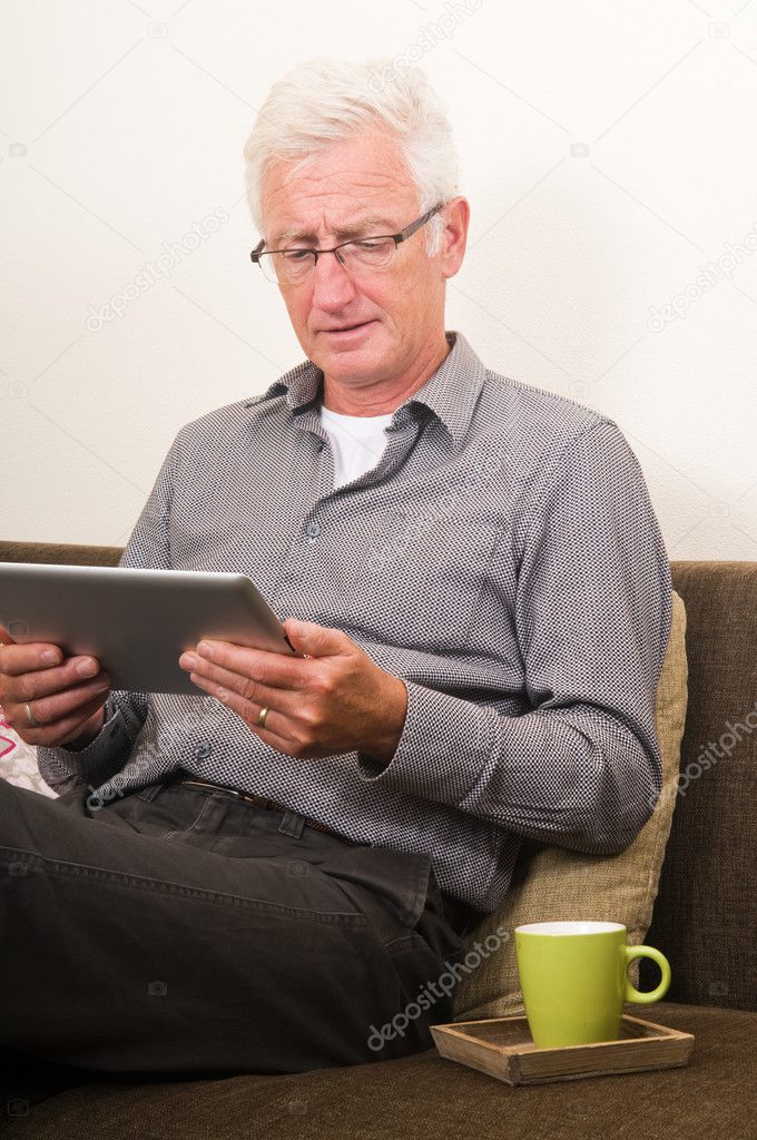 Senior working on a tablet pc