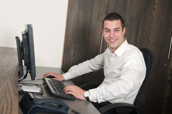 Male worker at a helpdesk — Stock Photo, Image