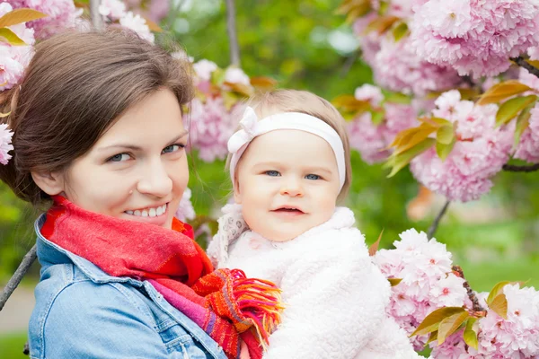 Mother with baby in the garden — Stock Photo, Image