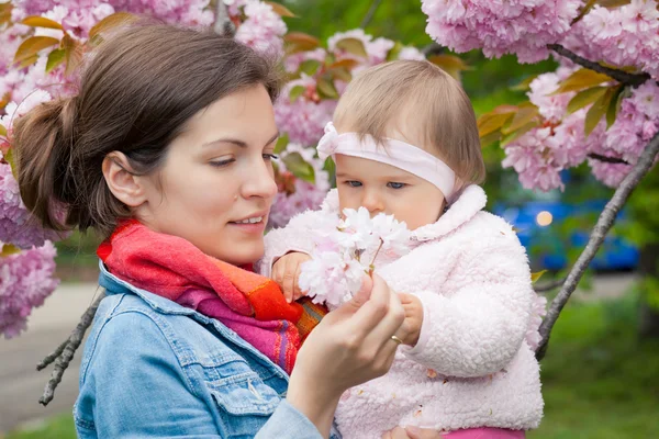 Mother with baby in the garden — Stock Photo, Image