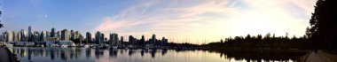 Vancouver skyline wide panorama at dusk clipart