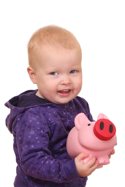 Kleinkind mit Sparschwein — Stockfoto