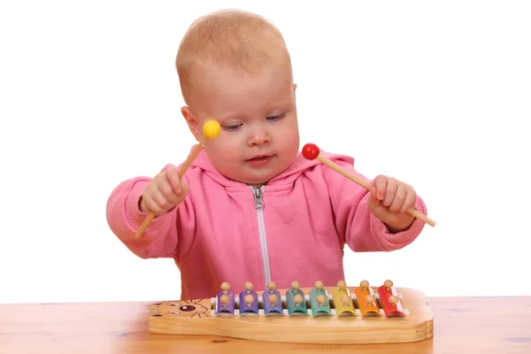 Girl plays xylophone — Stock Photo, Image