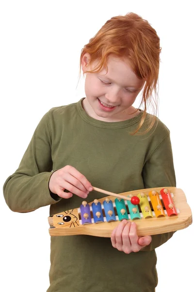 Girl plays xylophone — Stock Photo, Image