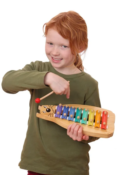 Girl plays xylophone — Stock Photo, Image