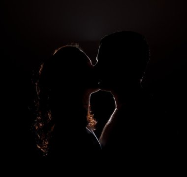 Silhouette of a kiss clipart