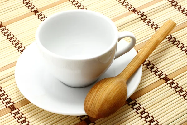 White cup with wooden spoon — Stock Photo, Image