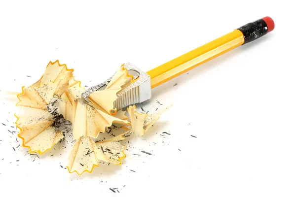 Sharpening pencil and wood shavings Royalty Free Stock Images