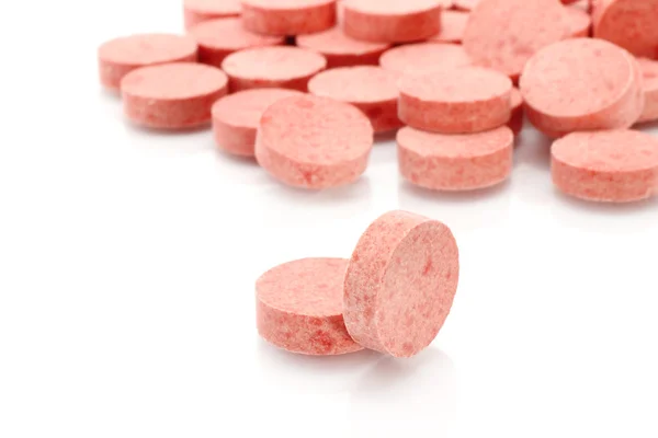 Červená medicína tabletky detail — Stock fotografie