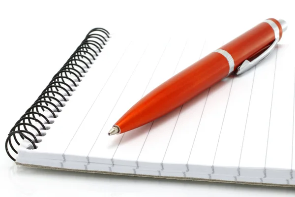 Notatnik z pomarańczowy długopis — Zdjęcie stockowe