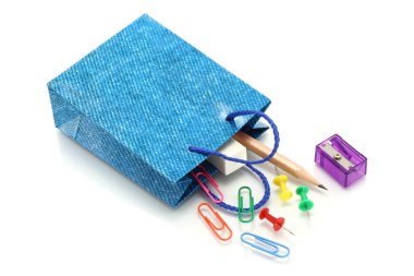 Stationery items poured out from shopping bag clipart