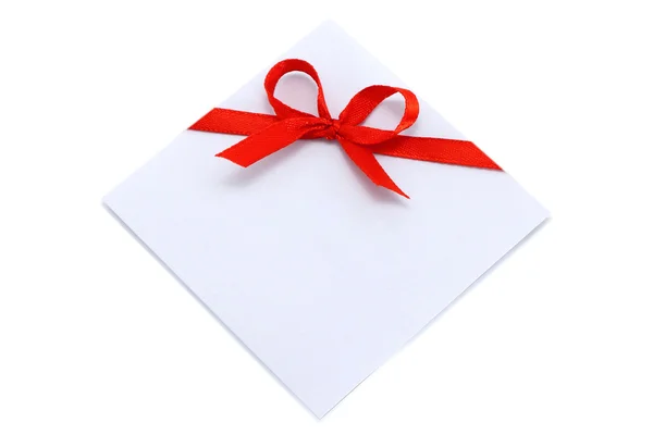 Piece of paper with red bow — Stock Photo, Image