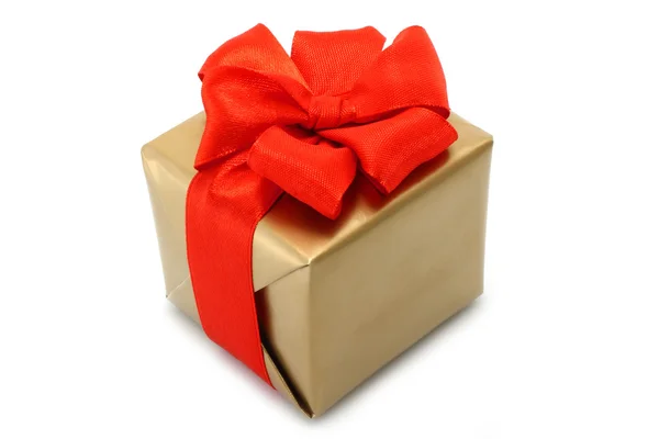 Gold present box with red bow — Stock Photo, Image