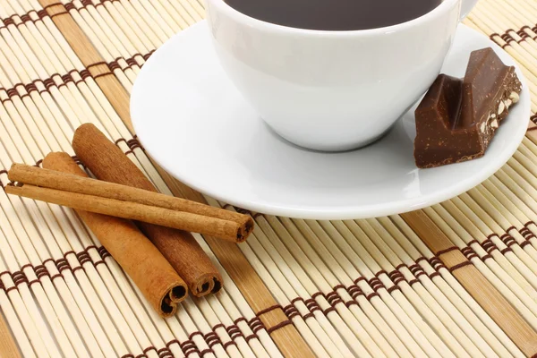 Cup of coffee with chocolate and cinnamon — Stock Photo, Image
