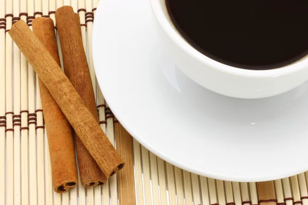 Xícara de café e canela — Fotografia de Stock