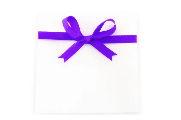 Sheet with purple holiday bow — Stock Photo, Image