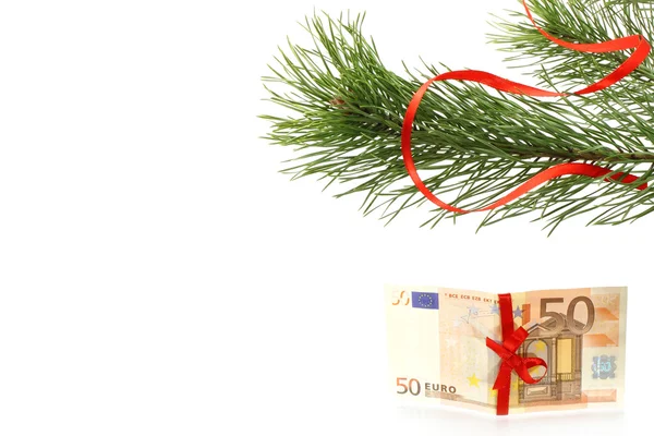Fir tree branch with money present — Stock Photo, Image