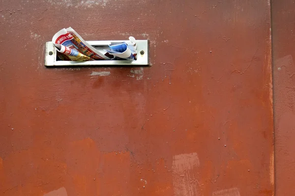 Red steel door with mailbox — Stock Photo, Image