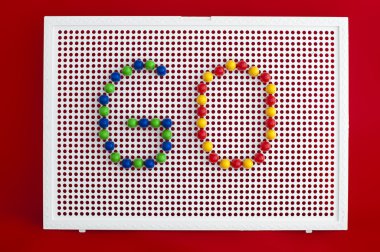 Go text.Colorful letters on mosaic. clipart