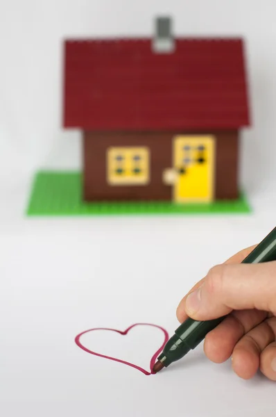 Hand schilderij hart en huis op achtergrond schrijven. — Stockfoto