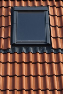 Dormer on a tiled roof clipart