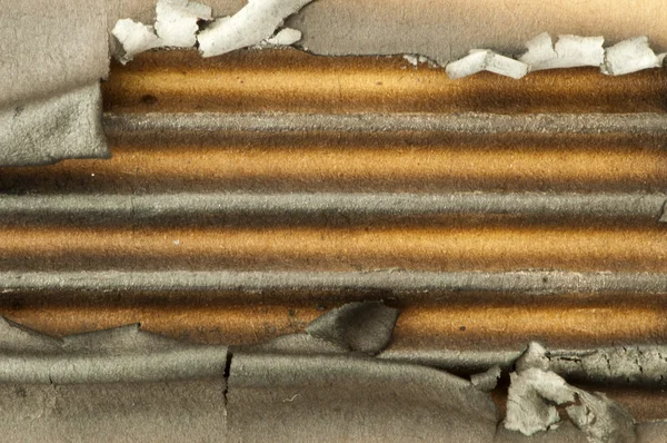 Burned paper and hole — Stock Photo, Image
