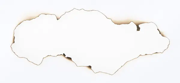 Yanmış kağıt ve delik — Stok fotoğraf