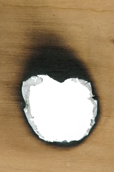 Papier et trou en bois brûlé — Photo