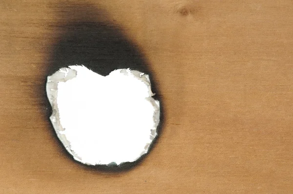 Ahşap kağıt ve delik yandı — Stok fotoğraf