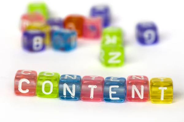 Text Content on colorful wooden cubes — Stock Photo, Image