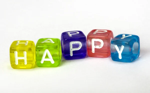 Texto feliz de cubos coloridos — Fotografia de Stock