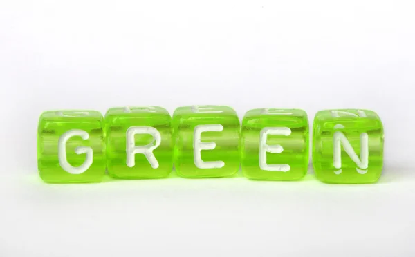 Text Green on colorful cubes — Stock Photo, Image